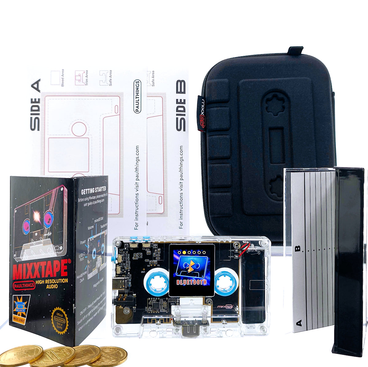 Mixxtape along with its accompanying accessories. The Mixxtape, an innovative cassette-shaped music player, takes center stage. Surrounding it are the included items that enhance the experience. These accessories include a USB-C cable for charging and data transfer, a Walkman-inspired premium travel case for protection and portability, a jewel case featuring a special edition Nintendo-inspired cover, arcade tokens for a playful touch, and printable DIY skins for personal customization.